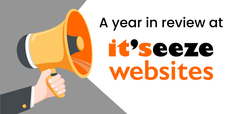 A megaphone with a speech bubble stating "A year in review at it'seeze websites".